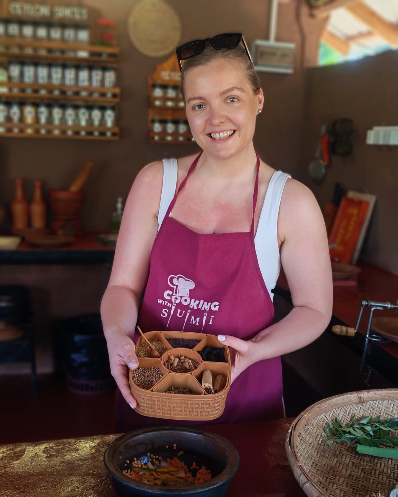 Guest holding traditional Sri Lankan spice tray